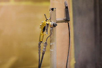 Image showing urethane finish or polish sprayer on hanger