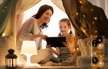 Image showing family with tablet pc in kids tent at home