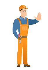 Image showing Caucasian builder showing stop hand gesture.