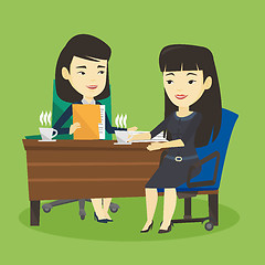 Image showing Two businesswomen during business meeting.