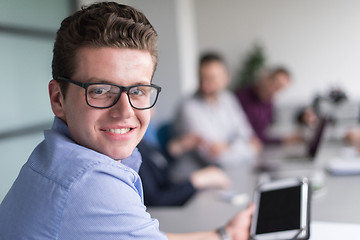 Image showing Businessman using tablet in modern office