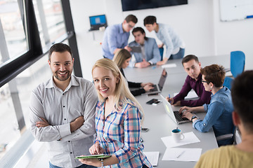 Image showing Two Business People Working With Tablet in office