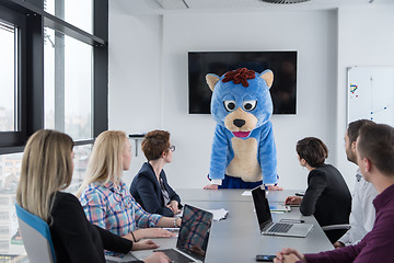 Image showing boss dresed as bear having fun with business people in trendy of