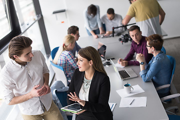 Image showing Two Business People Working With Tablet in office