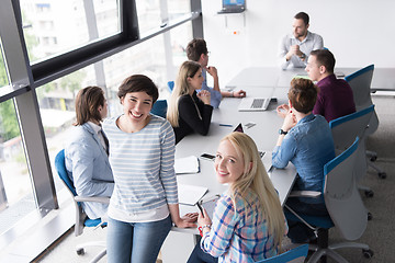 Image showing Pretty Businesswomen Using Tablet In Office Building during conf