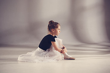 Image showing The little balerina dancer on gray background