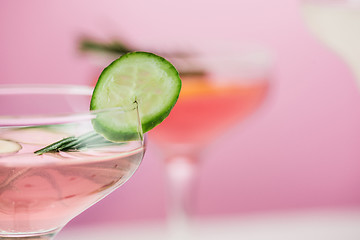 Image showing The rose exotic cocktails and fruits on pink