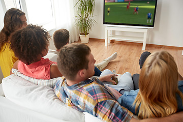 Image showing friends watching soccer game on tv at home