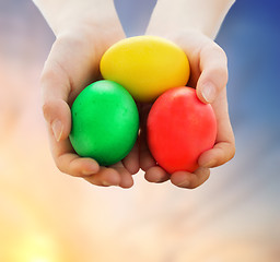 Image showing close up of girl holding colored easter eggs