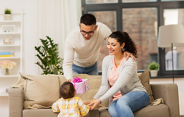 Image showing happy family with birthday present at home