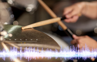 Image showing drummer playing drum kit at sound recording studio