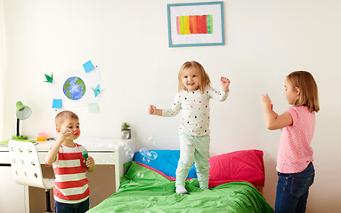 Image showing kids blowing soap bubbles and playing at home