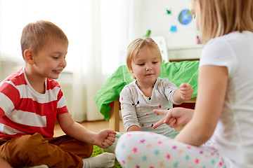 Image showing kids playing rock-paper-scissors game at home