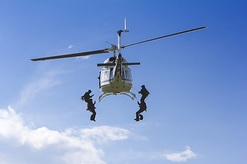 Image showing Special forces in helicopter with blue sky on background