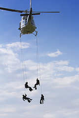 Image showing Special forces in helicopter with blue sky on background