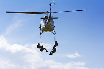 Image showing Special forces in helicopter with blue sky on background