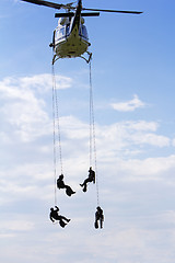 Image showing Special forces in helicopter with blue sky on background