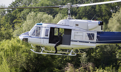 Image showing Special forces in helicopter in a low flight