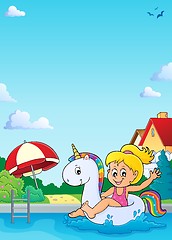 Image showing Girl floating on inflatable unicorn 4