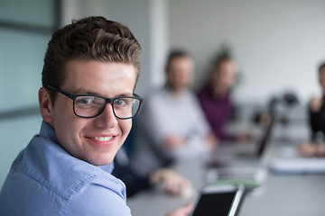 Image showing Businessman using tablet in modern office