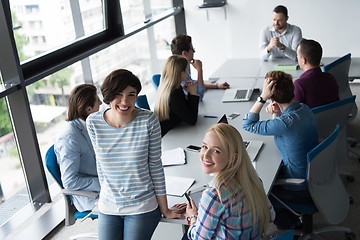 Image showing Pretty Businesswomen Using Tablet In Office Building during conf