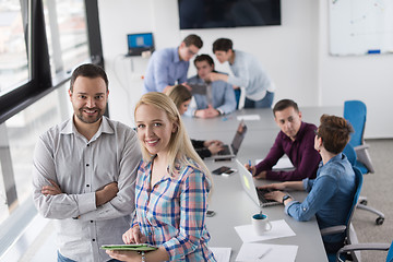 Image showing Two Business People Working With Tablet in office