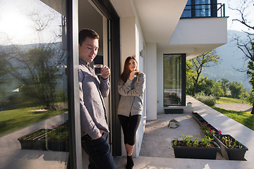 Image showing couple enjoying on the door of their luxury home villa