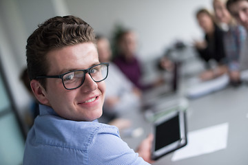 Image showing Businessman using tablet in modern office