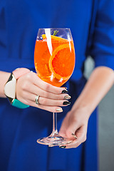 Image showing The exotic cocktail and female hands