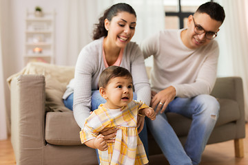 Image showing happy family with baby daughter at home