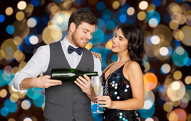 Image showing happy couple with champagne and glass at party