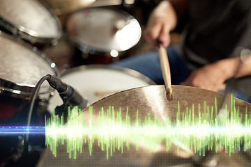 Image showing drummer playing drum kit at sound recording studio