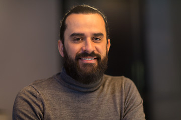 Image showing smiling middle eastern man in polo neck sweater