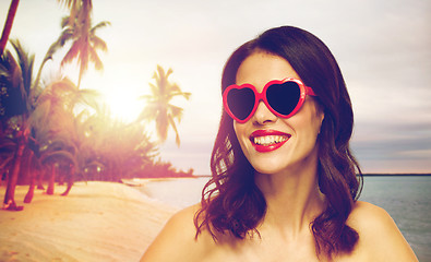 Image showing woman with red lipstick and heart shaped shades