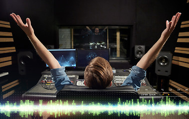 Image showing man at mixing console in music recording studio