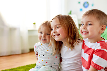 Image showing happy little kids hugging at home