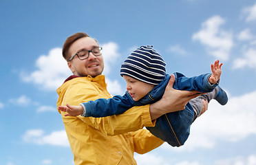 Image showing father with son playing and having fun outdoors