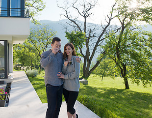 Image showing couple enjoying morning coffee