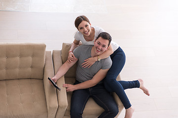 Image showing couple relaxing at  home with tablet computers