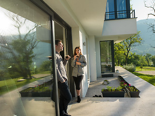 Image showing couple enjoying on the door of their luxury home villa