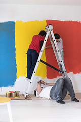 Image showing boys painting wall