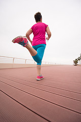 Image showing woman busy running on the promenade