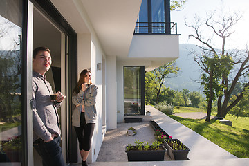 Image showing couple enjoying on the door of their luxury home villa