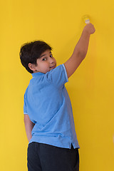 Image showing Portrait of a happy young boy painter