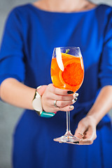 Image showing The exotic cocktail and female hands