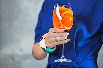 Image showing The exotic cocktail and female hands