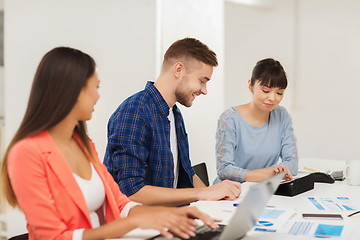 Image showing happy creative team or students working at office