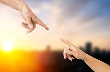 Image showing close up of senior and young woman hands