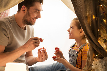 Image showing family playing tea party in kids tent at home