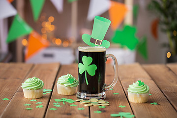 Image showing shamrock on glass of beer, green cupcakes and coins